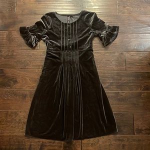 velvet girls dress with ruffled sleeves and button pleat details on front